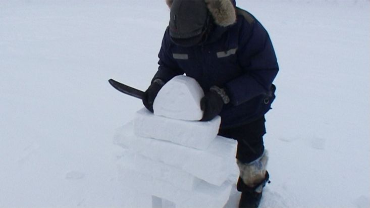 Inuit from Arctic Bay building an 