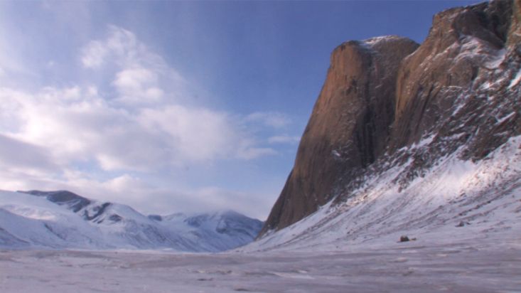 Skiing towards a gigantic rock wall - Akshayuk Pass 2008 expedition