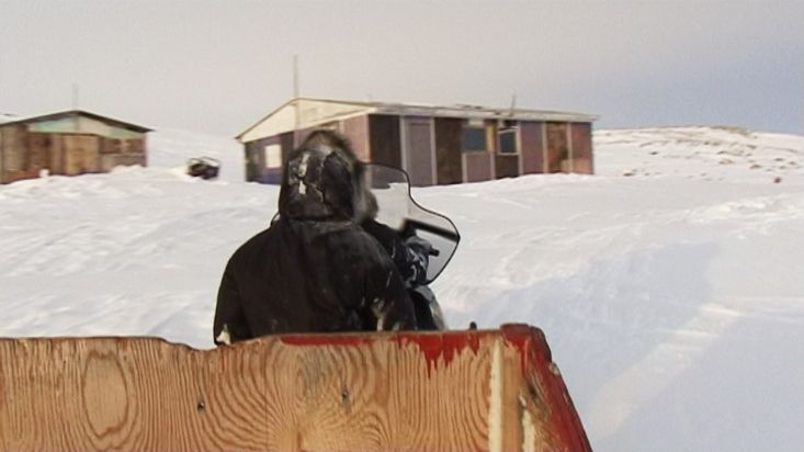 Arrival in snowmobile to Ravenscraig's log cabin - Sam Ford Fiord 2010 expedition