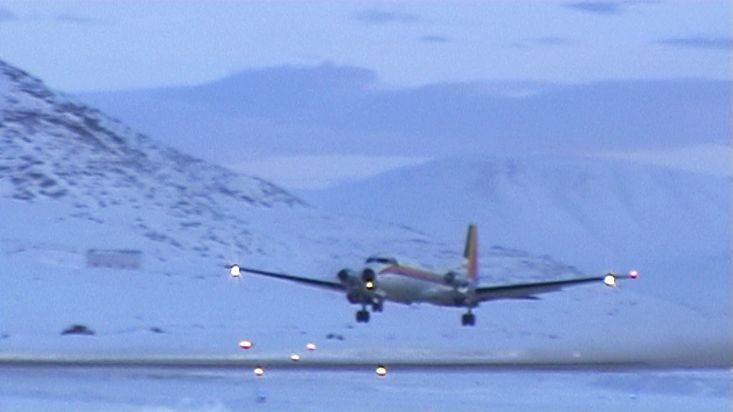 A plane taking off at sunset from Qikiqtarjuaq airport - Nanoq 2007 expedition