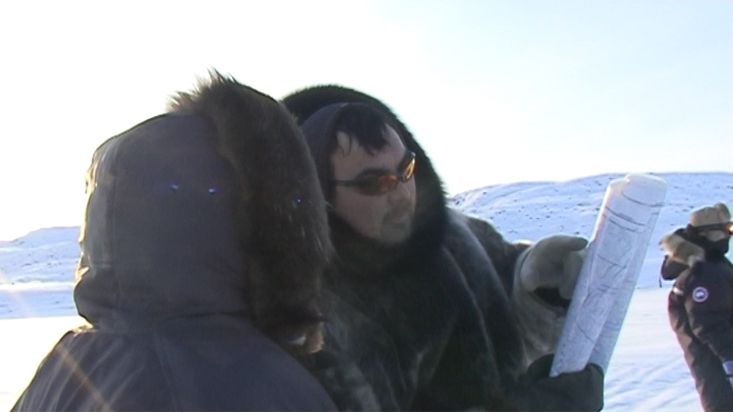 Charlie and his Inuit friend consulting the map - Penny Icecap 2009 expedition