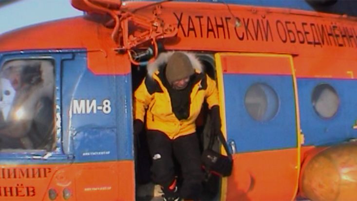 Descending from the helicopter on the icepack - Geographic North Pole 2002 expedition