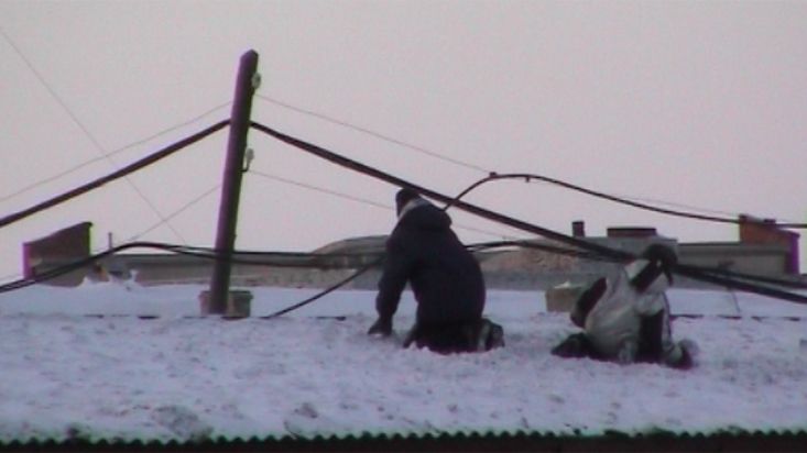 Children playing on the roofs of Khatanga - Geographic North Pole 2002 expedition