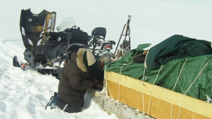 Repair of a snowmobile on the route to the Barnes - Barnes Icecap expedition - 2012